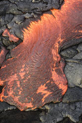 Lava flow over volcanic black rock. - MINF16389