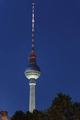 Germany, Berlin, Berlin Television Tower standing against clear sky at night - ABOF00717