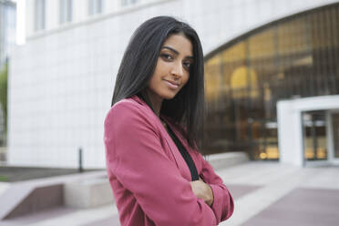 Confident female professional standing with arms crossed - JCCMF04172