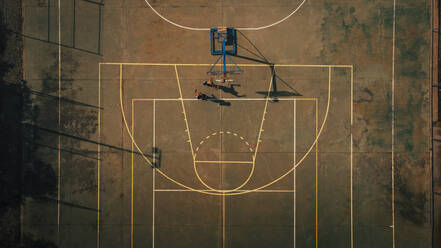 Male friends playing basketball at sports court - ACPF01340