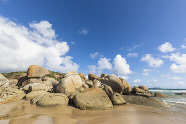 Boulders on sandy coastal beach in summer, Australia - FOF12219