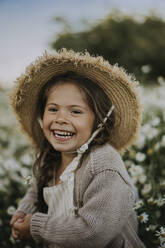 Cheerful girl with hat at flower field - SSGF00016