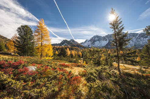 Sun shining over scenic autumn landscape of Ennstal Alps - HHF05813