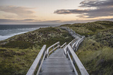 Empty coastal boardwalk at dusk - KEBF02049