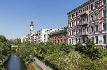 Germany, Saxony, Leipzig, Row of townhouses standing along Karl-Heine-Kanal in summer - GWF07222