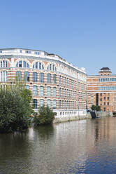 Germany, Saxony, Leipzig, Clear sky over Karl-Heine-Kanal with waterfront apartments in background - GWF07226