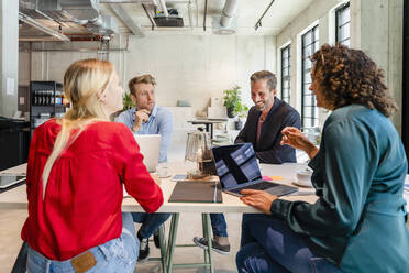 Employees working in meeting at office - DIGF16648