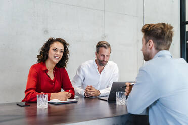 Businesswoman taking job interview with male colleague in office - DIGF16842