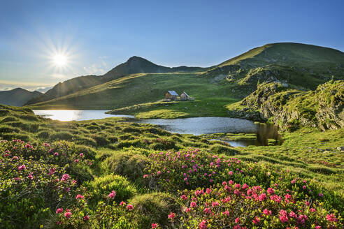 Sunlight on lake at Predigtstuhl mountain at Biosphere Park Nockberge, Carinthia, Austria - ANSF00074