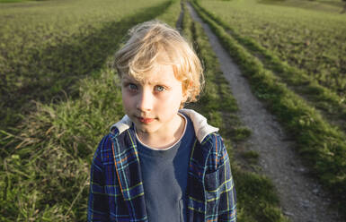 Blond boy on field - IHF00592