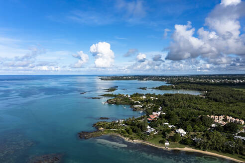 Mauritius, Riviere du Rempart, Cap Malheureux, Helicopter view of Indian Ocean and coastal village in summer - AMF09299
