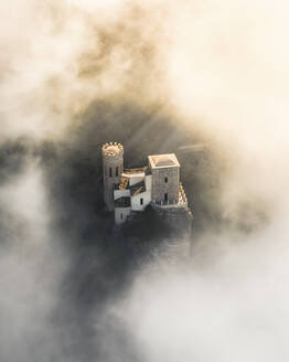 Aerial view of Pepoli tower during a foggy day, Erice, Sicily. - AAEF13195