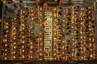 View of many people praying in a mosque burning incense before breaking the fasting during Rakher Upobash festival, Narayanganj, Bangladesh. - AAEF13270