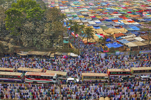 Dhaka, Bangladesh - 15 February 2019: View of many muslim people praying in the middle of the road in Dhaka, Bangladesh. - AAEF13331