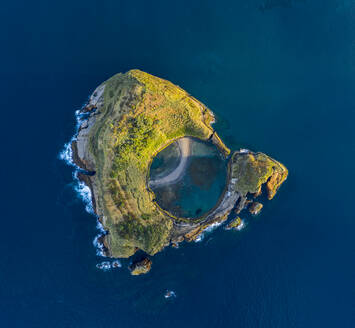 Aerial view of Ilheu da Vila, a small island off San Miguel island in the middle of the ocean, Azores islands, Portugal. - AAEF13344