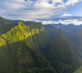 Aerial view of a waterfall (La Cascade Blanche) among the mountain landscape near Saint Andrè, Saint Benoit, Reunion. - AAEF13346