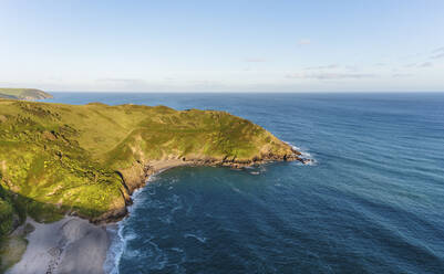 Aerial view of Lantic Bay, a secret coves along the coast at sunset, Polruan, Cornwall, United Kingdom. - AAEF13370