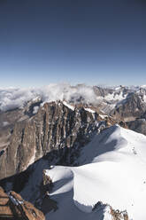 Snowcapped mountains on sunny day at Aiguille Du Midi, Mont Blanc, Chamonix, France - JAQF00867