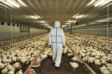 Man in protective suit at production factory - VEGF05222