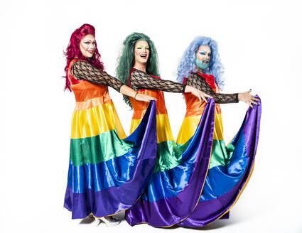 Drag queens holding rainbow dresses over white background - GPF00189