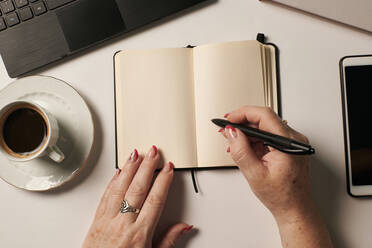 Business still live of an unrecognizable woman writing in a notebook - CAVF95111