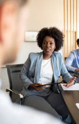 Black businesswoman talking during meeting - CAVF95322