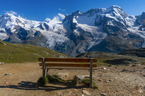 Scenic view of Gorner Glacier with empty bench in foreground - RUNF04684