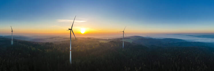 Aerial panorama of wind farm in forested Schurwald range at sunset - WDF06676