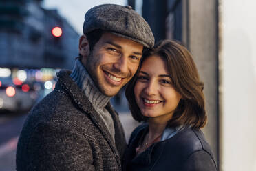 Happy young couple together in city - MEUF04777