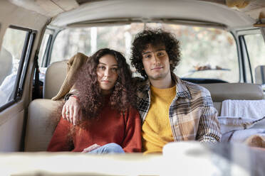 Young couple sitting in campervan - EIF02475