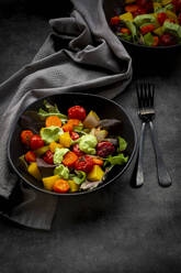 Studio shot of two bowls of vegan salad with baked vegetables - LVF09170