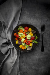 Studio shot of bowl of vegan salad with baked vegetables - LVF09171