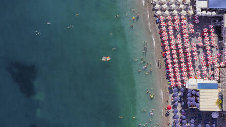 Aerial view of a crowded beach in Amalfi along the Amalfi Coast, Salerno, Campania, Italy. - AAEF13519