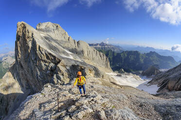 Female climber ascending ridge of Marmolada mountain - ANSF00098