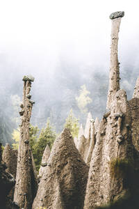 Foggy sky over the earth pyramids, ancient rock formation, Renon (Ritten), Bolzano, South Tyrol, Italy, Europe - RHPLF20942