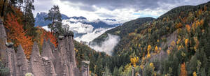 Mist over the earth pyramids and forest in autumn, Longomoso, Renon (Ritten), Bolzano, South Tyrol, Italy, Europe - RHPLF20943