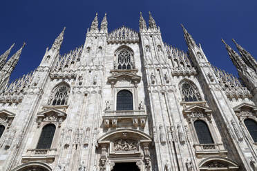 The west facade of the Duomo, the Gothic style cathedral dedicated to St. Mary, Milan, Lombardy, Italy, Europe - RHPLF21003