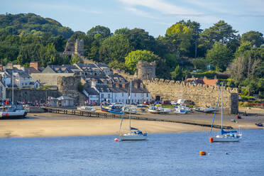 View of boats of the Conwy River and town wall, Conwy, Gwynedd, North Wales, United Kingdom, Europe - RHPLF21020