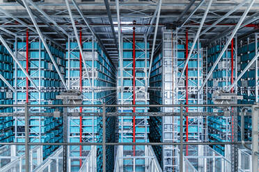 Blue containers in racks side by side at warehouse - DIGF16996