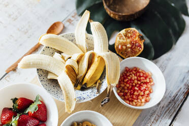 Ripe fruits in bowls on table at home - EGHF00272