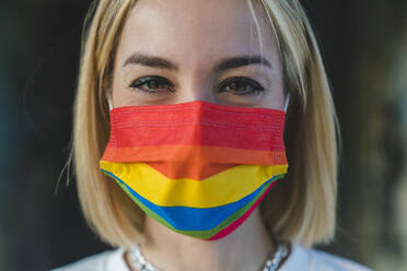 Blond woman with rainbow flag protective face mask - MGIF01189