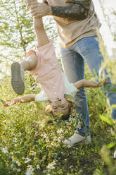Father and daughter enjoying in meadow - SEAF00200