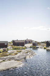 Cottages at island by sea against sky - MASF27588