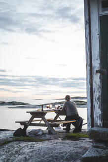 Rear view of woman spending leisure time at island - MASF27613