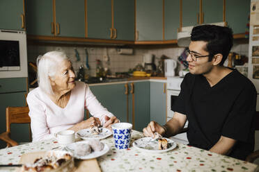 Male healthcare worker having snacks together in kitchen - MASF27700