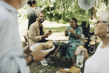 Male and female customers having street food - MASF27752