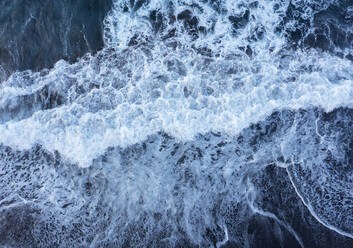 Drone view of waves brushing sand of Praia de Santa Barbara - WWF05876