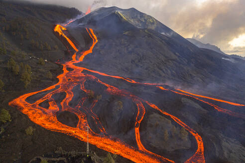 Aerial top down view of lava floating down the Volcan Cumbre Vieja, a volcano during eruption near El Paraiso town, Las Manchas, La Palma Island, Canary Islands, Spain. - AAEF13600