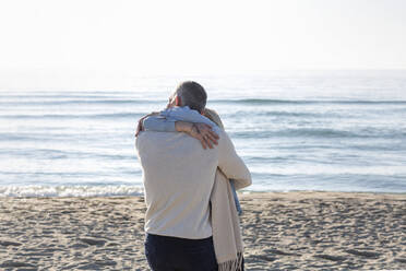Couple embracing each other at beach - EIF02560