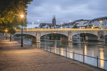 Switzerland, Basel-Stadt, Basel, Promenade stretching along river Rhine canal with Middle Bridge in background - KEBF02079